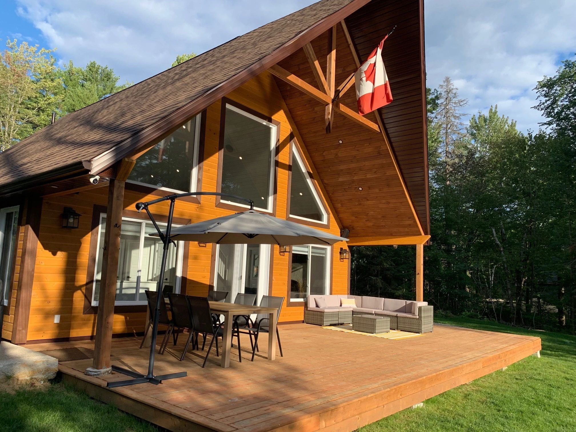 Lodge exterior with deck and Canadian flag